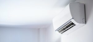 Ductless Air Conditioner On White Wall Room Interior Background